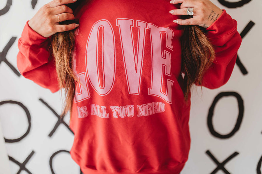 LOVE IS ALL YOU NEED WOMEN'S SWEATSHIRT | RED