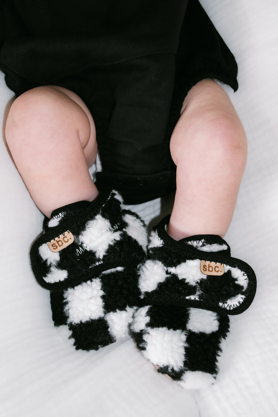 SHORE BABY The Newborn Sherpa Bootie — Black + White Checkered (COLLECTIVE)