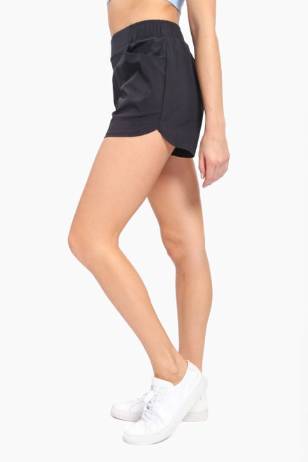 CARRIE ATHLEISURE SHORT WITH CURVED HEMLINE | BLACK