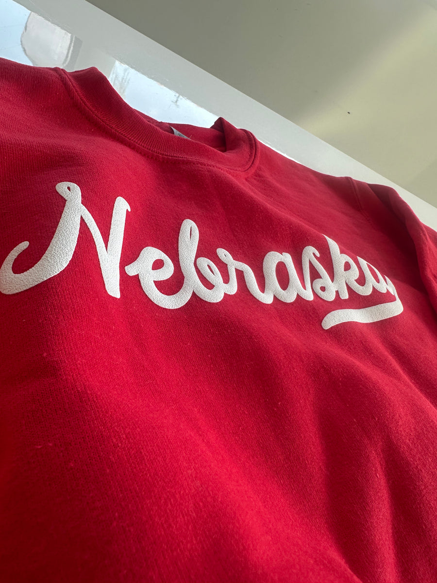NEBRASKA SCRIPT PUFF PRINT YOUTH SWEATSHIRT | RED