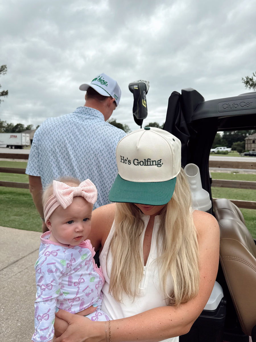 He's Golfing - Green Vintage Trucker Hat